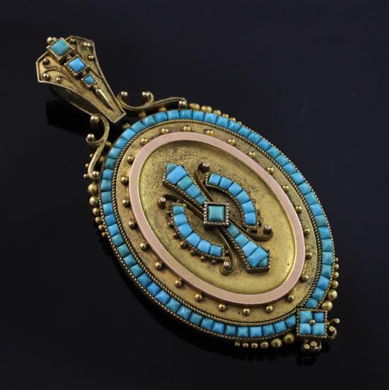 A Victorian Etruscan style gold and turquoise set oval pendant locket, 2.75in inc. bale.